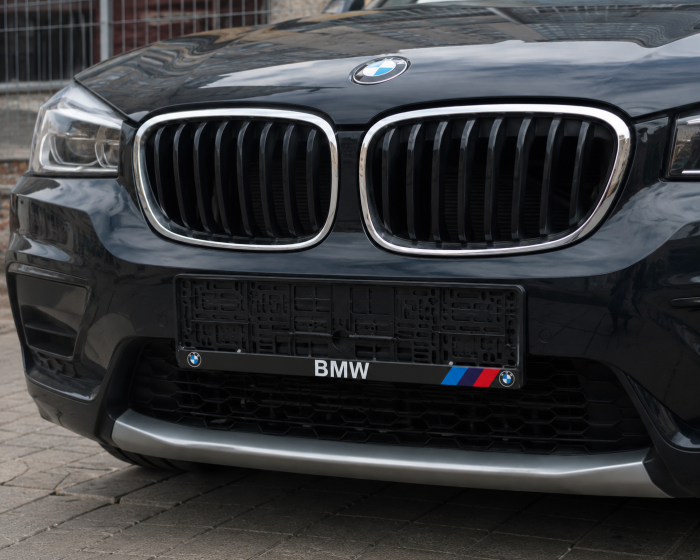 Рамка номерного знаку BMW пластикова Poputchik (1шт)